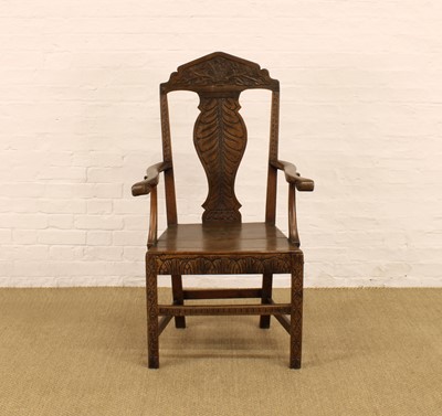 Lot 252 - A George III and Later Carved Country Oak Armchair