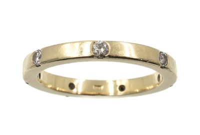 Lot 199 - An 18ct gold and diamond eternity ring