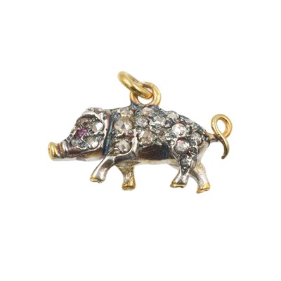 Lot 232 - A diamond and ruby pig pendant, set in 14ct gold and silver