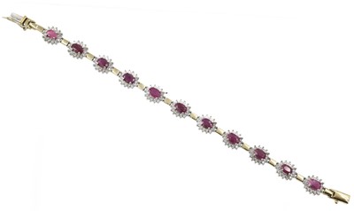Lot 103 - An 18ct gold, ruby and colourless stone bracelet