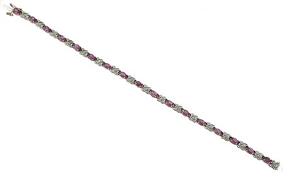 Lot 81 - A pink sapphire and diamond tennis bracelet, set in 9ct gold