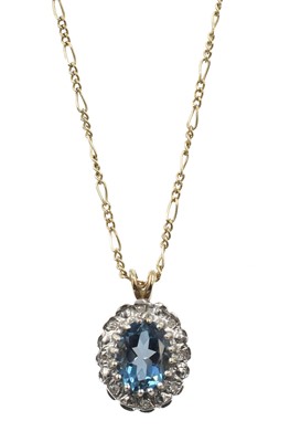 Lot 243 - A topaz and diamond cluster pendant, set in 9ct gold