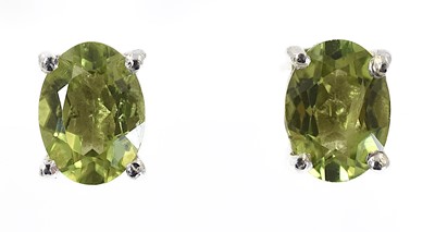 Lot 261 - A pair of silver peridot stud earrings