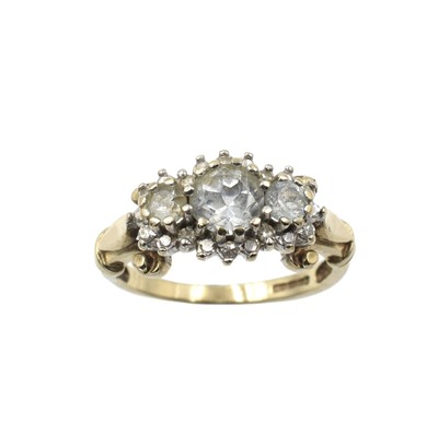 Lot 262 - An aquamarine and diamond three-stone cluster ring, set in 9ct gold
