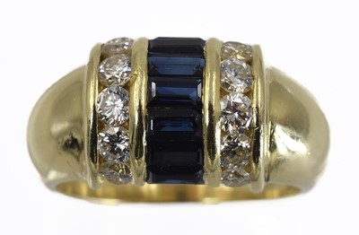 Lot 334 - A diamond and sapphire ring, set in 18ct gold