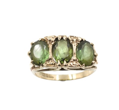 Lot 347 - A tourmaline three-stone ring, set in 9ct gold