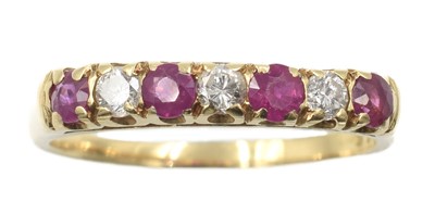 Lot 216 - An 18ct yellow gold ruby and diamond ring