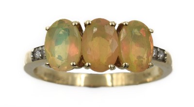 Lot 250 - An opal and diamond trilogy ring, set in 9ct gold