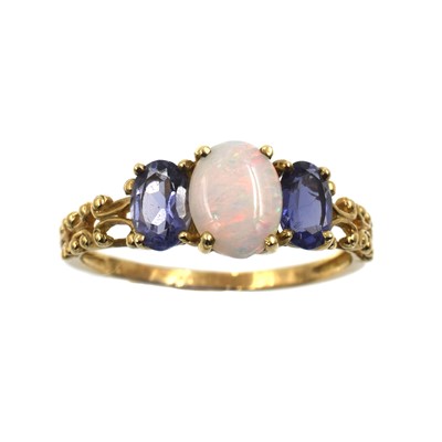 Lot 227 - An opal and tanzanite three-stone ring, set in 9ct gold