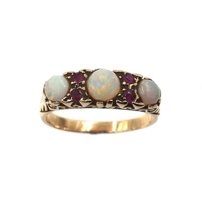 Lot 102 - An opal and ruby boat ring, set in 9ct gold