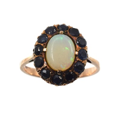 Lot 207 - An opal and sapphire cluster ring, set in 9ct gold