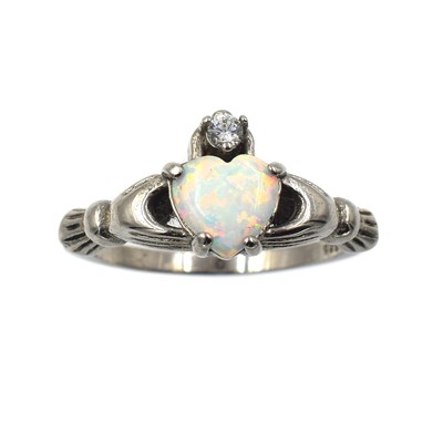 Lot 363 - An opal and silver Claddagh ring