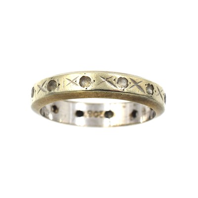 Lot 52 - A cubic zirconia wedding band, set in 9ct gold