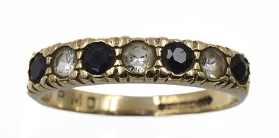 Lot 228 - A sapphire and cz half eternity ring, set in 9ct gold
