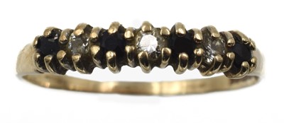 Lot 169 - A sapphire and cubic zirconia seven-stone ring, set in 9ct gold