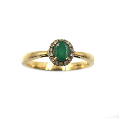 Lot 220 - An emerald and diamond halo ring, set in 9ct gold