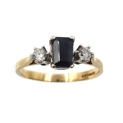 Lot 98 - A sapphire and cubic zirconia three-stone ring, set in 9ct gold