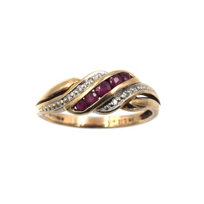 Lot 335 - A ruby and diamond interlocking ring, set in 9ct gold
