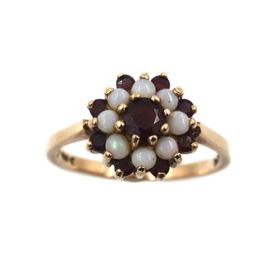 Lot 82 - A garnet and opal cluster ring, set in 9ct gold