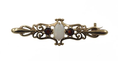 Lot 370 - An Edwardian opal and garnet brooch, set in 9ct gold