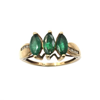 Lot 67 - An emerald and diamond three-stone ring, set in 9ct gold