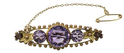 Lot 65 - A 9ct yellow gold amethyst bar brooch