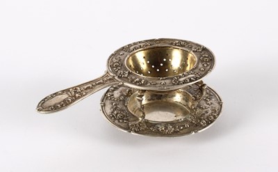 Lot 44 - A Late 19th/Early 20th Century German Silver Tea Strainer and Stand