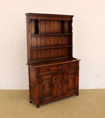 Lot 213 - A Carved and Stained Oak Dresser by Titchmarsh & Goodwin of Ipswich