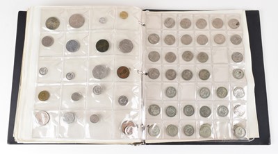 Lot 6 - An album of assorted British and world coins.