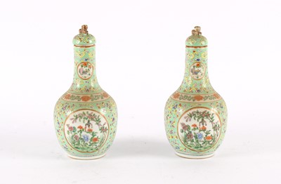 Lot 106 - A Pair of Late 19th/Early 20th Century Chinese Famille Rose Bottle Vases with Covers