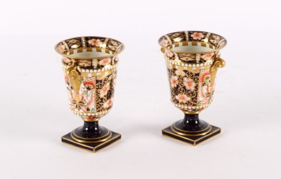 Lot 140 - A Pair of Royal Crown Derby Urns in the "Imari Witches" Pattern