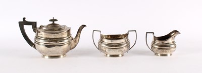 Lot 5 - A Matched Early 19th Century and Later Silver Three Piece Tea Service