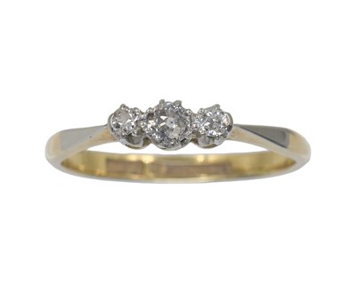 Lot An 18ct gold and diamond three-stone ring