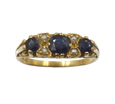Lot 87 - A 9ct yellow gold three-stone sapphire ring