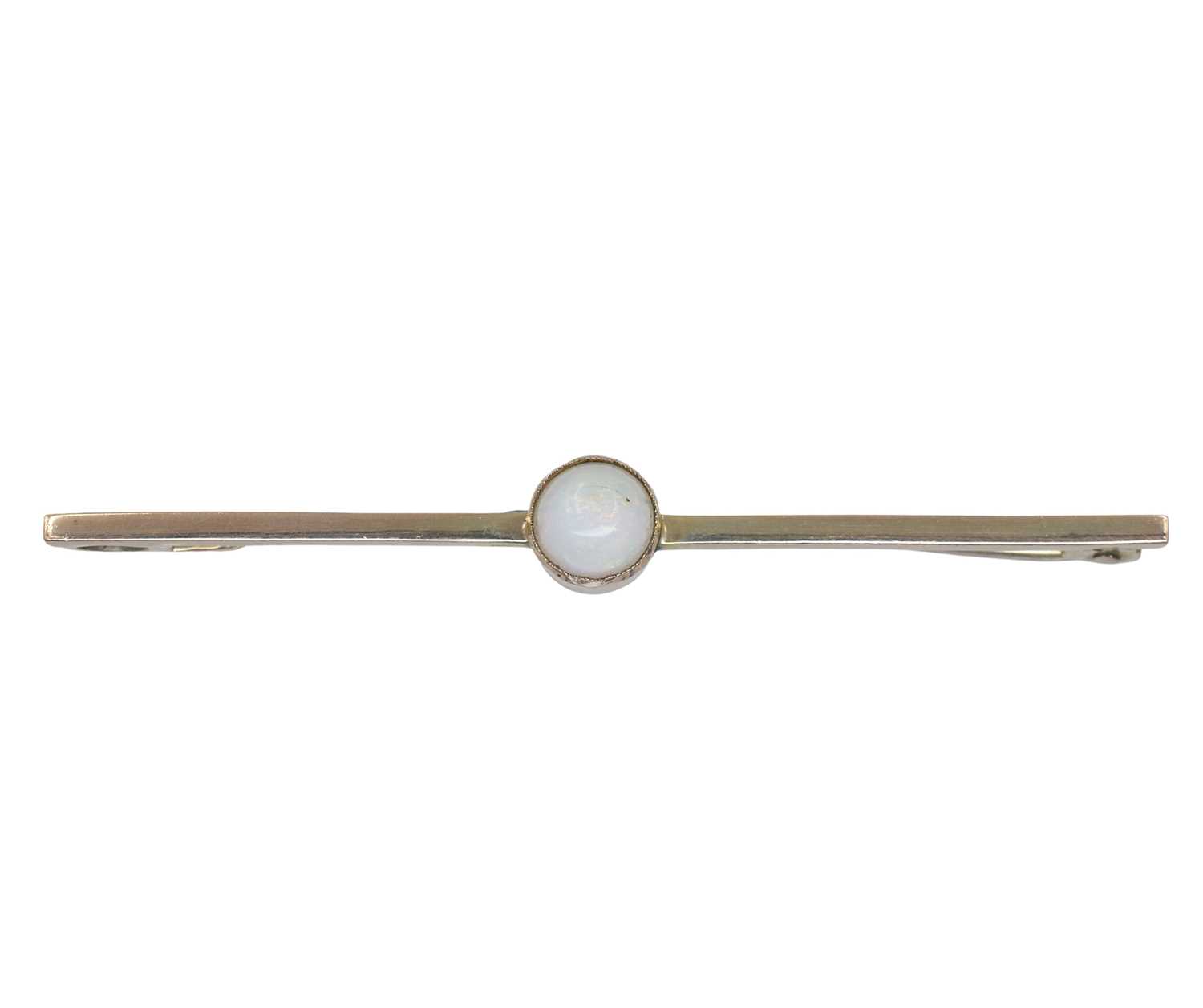 Lot 26 - A yellow metal and opal bar brooch