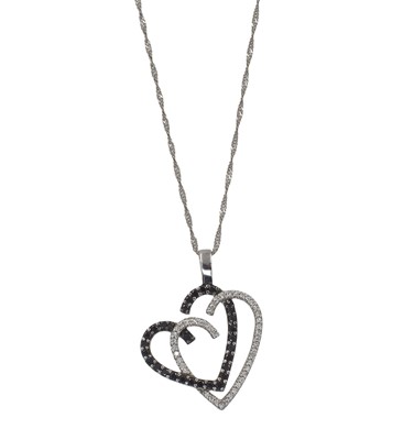 Lot 65 - An 18ct white gold and diamond "witch's heart" pendant