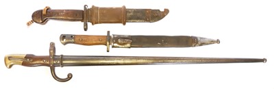 Lot 248 - Three bayonets and scabbards, to include a...