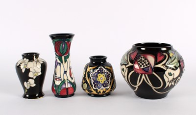 Lot 134 - Four Black Floral Vases by Moorcroft