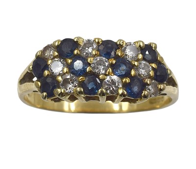 Lot 40 - An 18ct gold, diamond and sapphire cluster ring