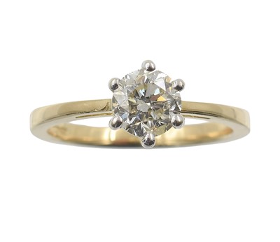Lot An 18ct gold and diamond solitaire ring