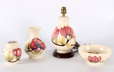 Lot 121 - "Magnolia" Bowl, Vase, Lamp, and Ginger Jar by Moorcroft
