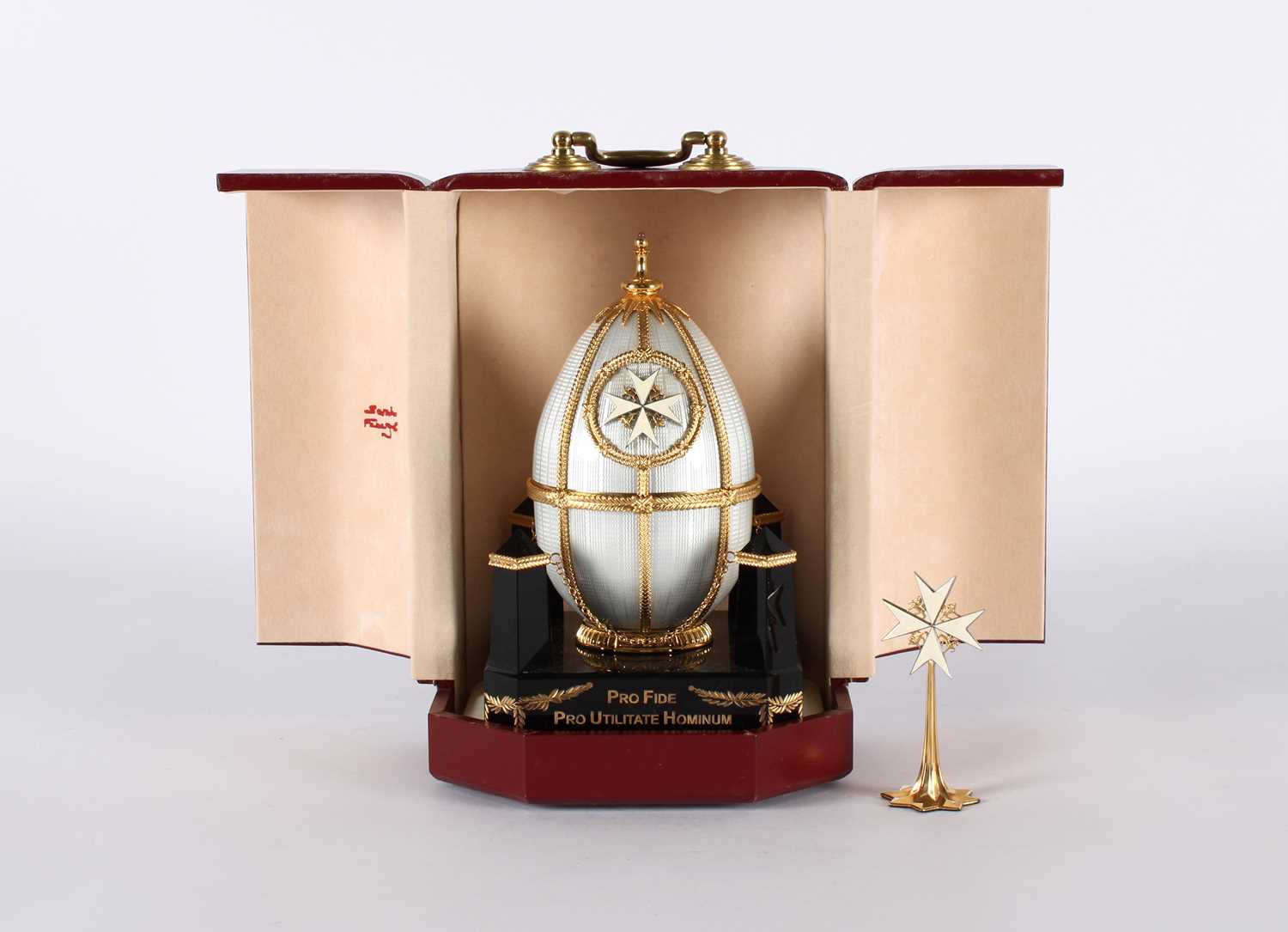 Lot An 'Order of St. John' Silver Gilt and Enamel Limited Edition Egg by Sarah Fabergé