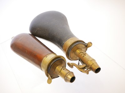 Lot 716 - Two powder flasks, one by Parker Hale after...