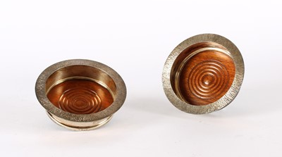Lot 44 - A Pair of Elizabeth II Modernist Silver Mounted Bottle Coasters
