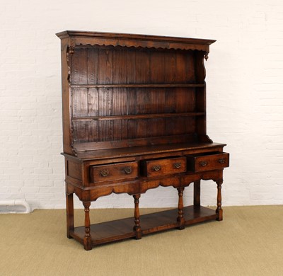 Lot 236 - A Reproduction Carved Oak Potboard Dresser Attributed to Titchmarsh & Goodwin