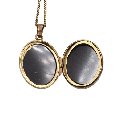 Lot A 9ct yellow gold locket pendant