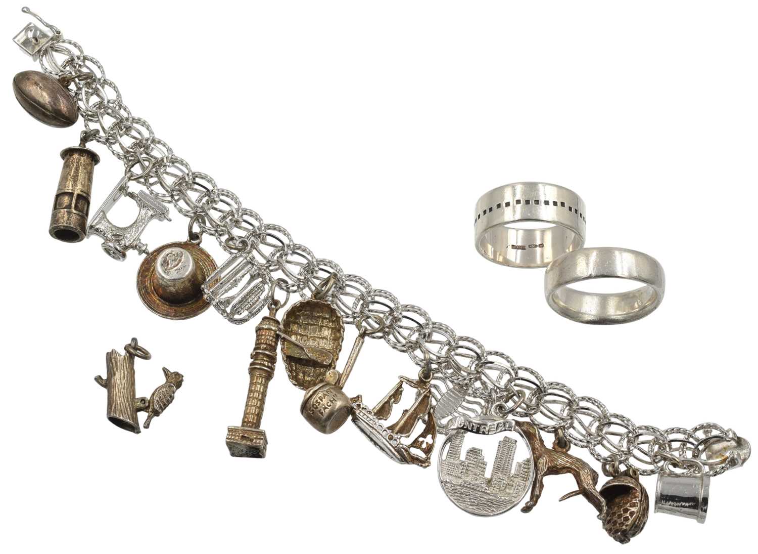 Lot A selection of 2 sterling silver rings and a white metal charm bracelet