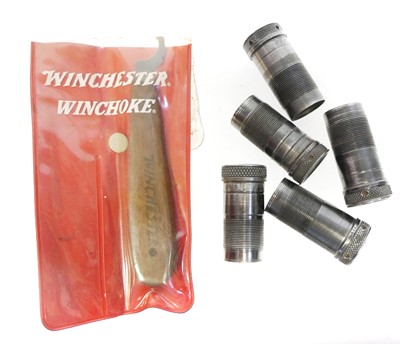Lot 810 - Set of five Winchester chokes and a key.