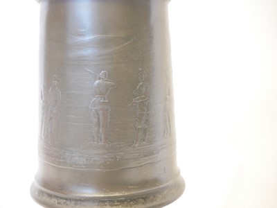 Lot 714 - Pewter rifle competition tankard, depicting a...