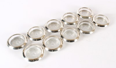 Lot 19 - A Set of Ten Early 20th Century American Sterling Silver Mounted Clear Glass Coasters